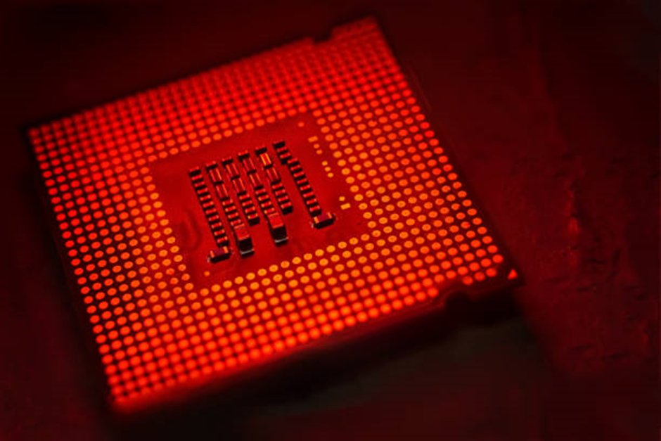 Close-up of a red-lit computer chip