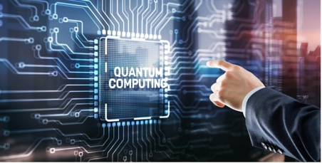 A hand reaching toward a glowing microchip labelled "Quantum Computing" with circuit-board traces